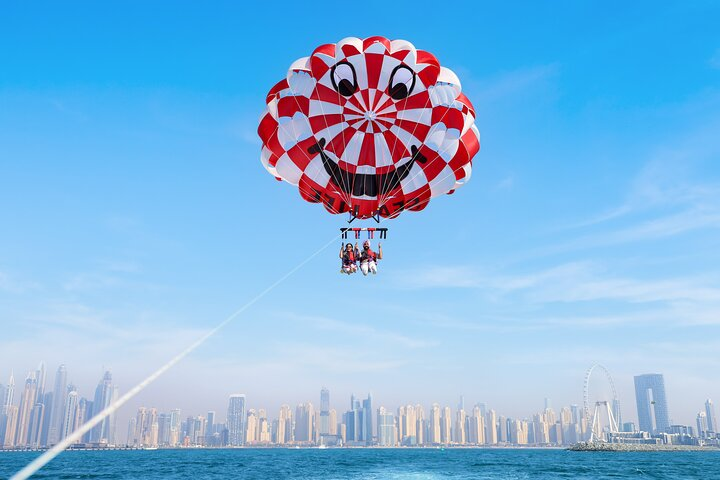 Soaring above Dubai offers a breathtaking perspective of the iconic Palm Jumeirah and JBR Beach. Experience the beauty of the cityscape while gliding through the clear skies.